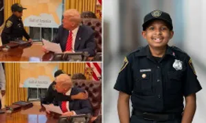 Mật vụ 13 tuổi ôm ông Trump trong Phòng Bầu dục Mật vụ 13 tuổi ôm ông Trump trong Phòng Bầu dục